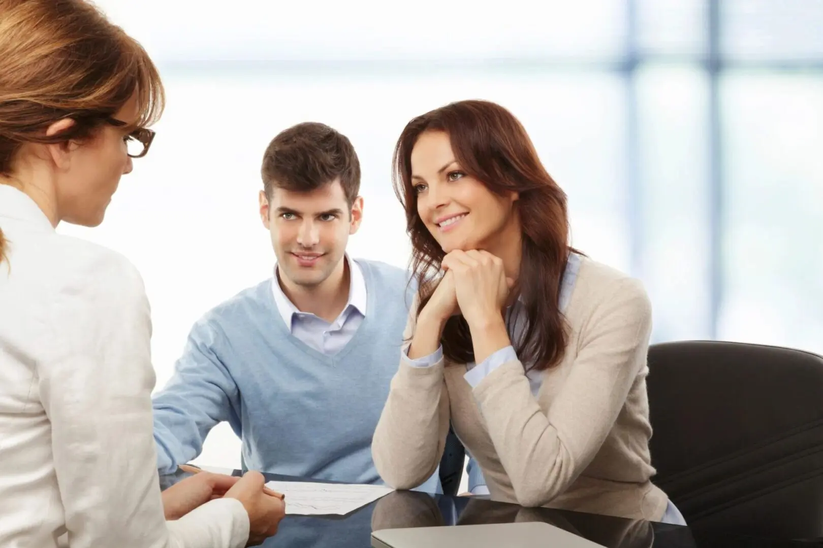 Young Couple Discussing Financial Plan With Consultant